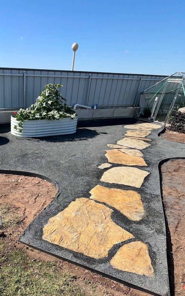 Flagstone path set in dark gravel with crisp edging